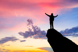 Silhouette of the man success on the peak of mountain,Sport and active life sunset landscape,Sports concept